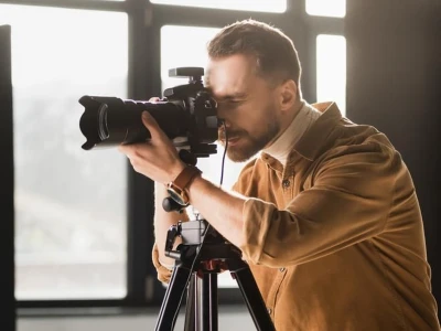 Photographer improving blurry photos with AI blur remover